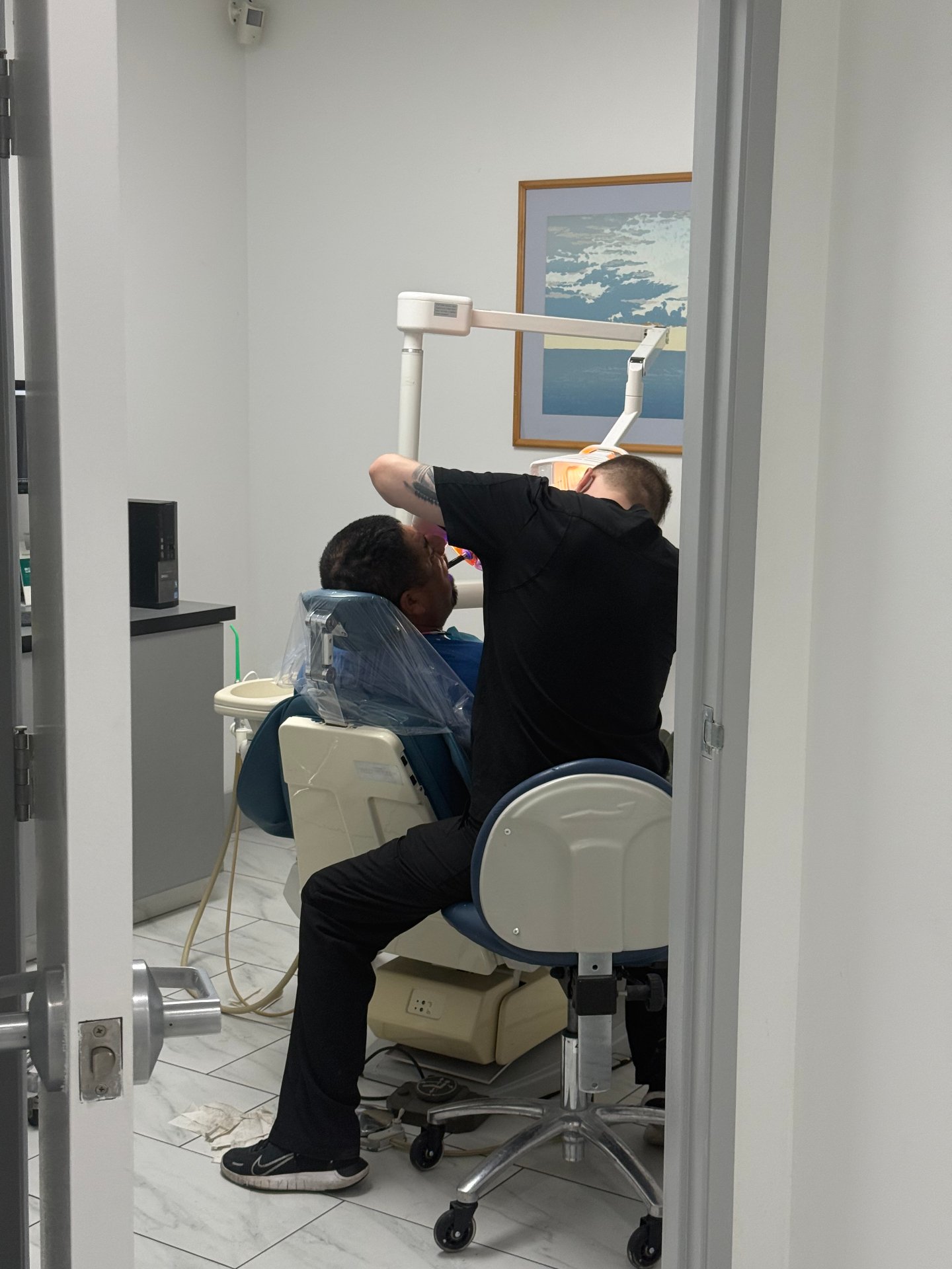 Dr. Ginzburg and team performing dental care